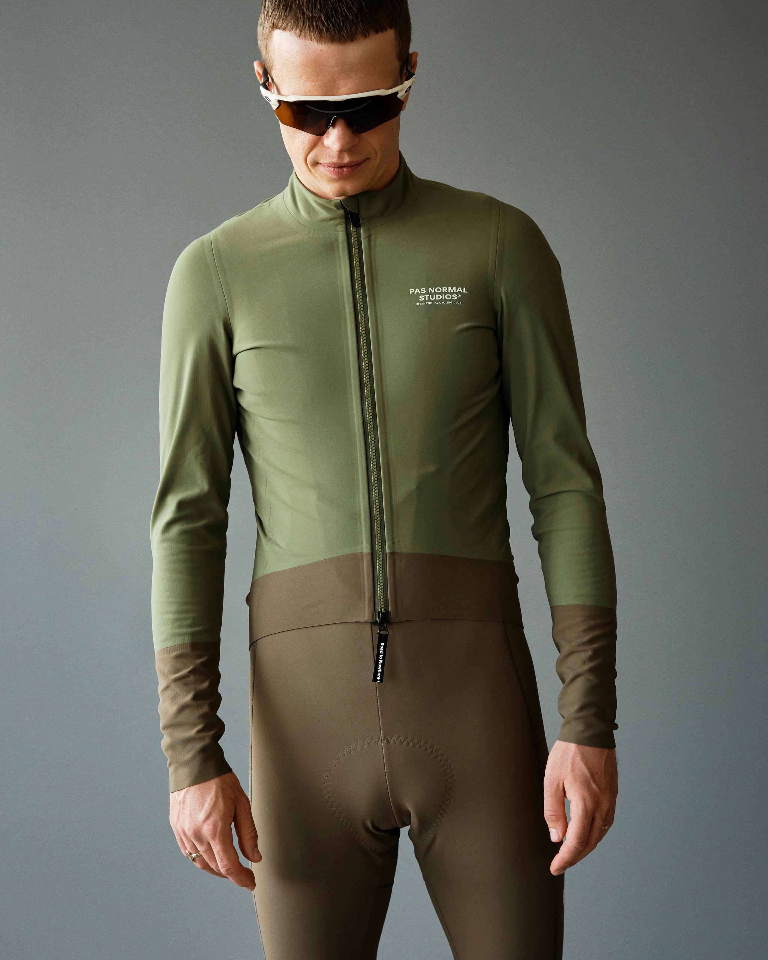Army Green Mechanism Thermal cycling jacket on model with brown contrast lower panel
