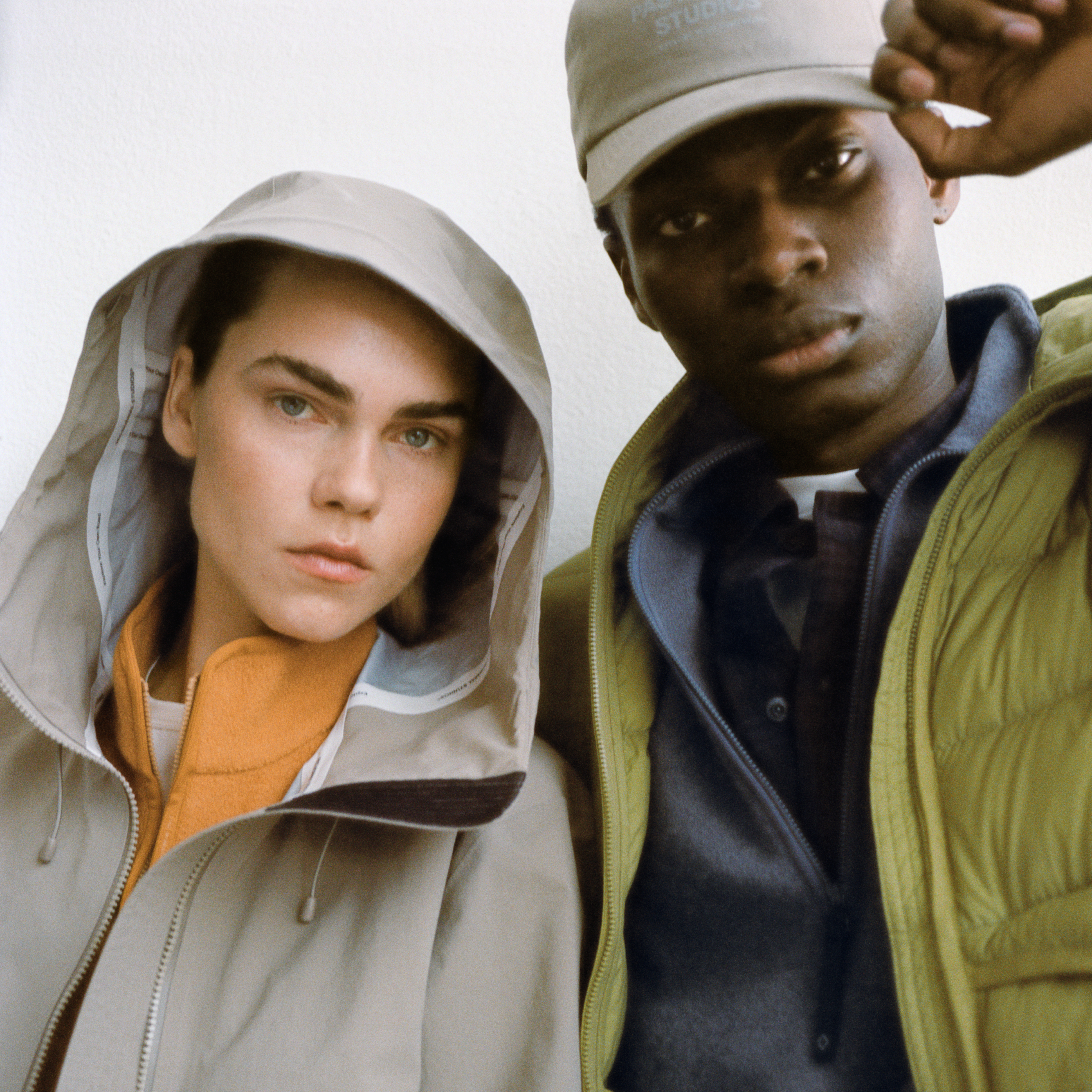 Olive green Off-Race Down Liner jacket on model, front view with quilted panels and zip closure