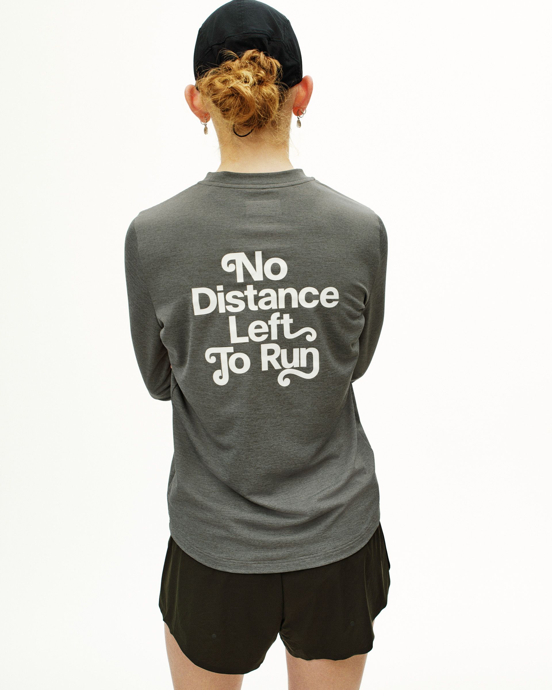 Grey Balance long sleeve t-shirt, rear view on model with white "No Distance Left To Run" back print