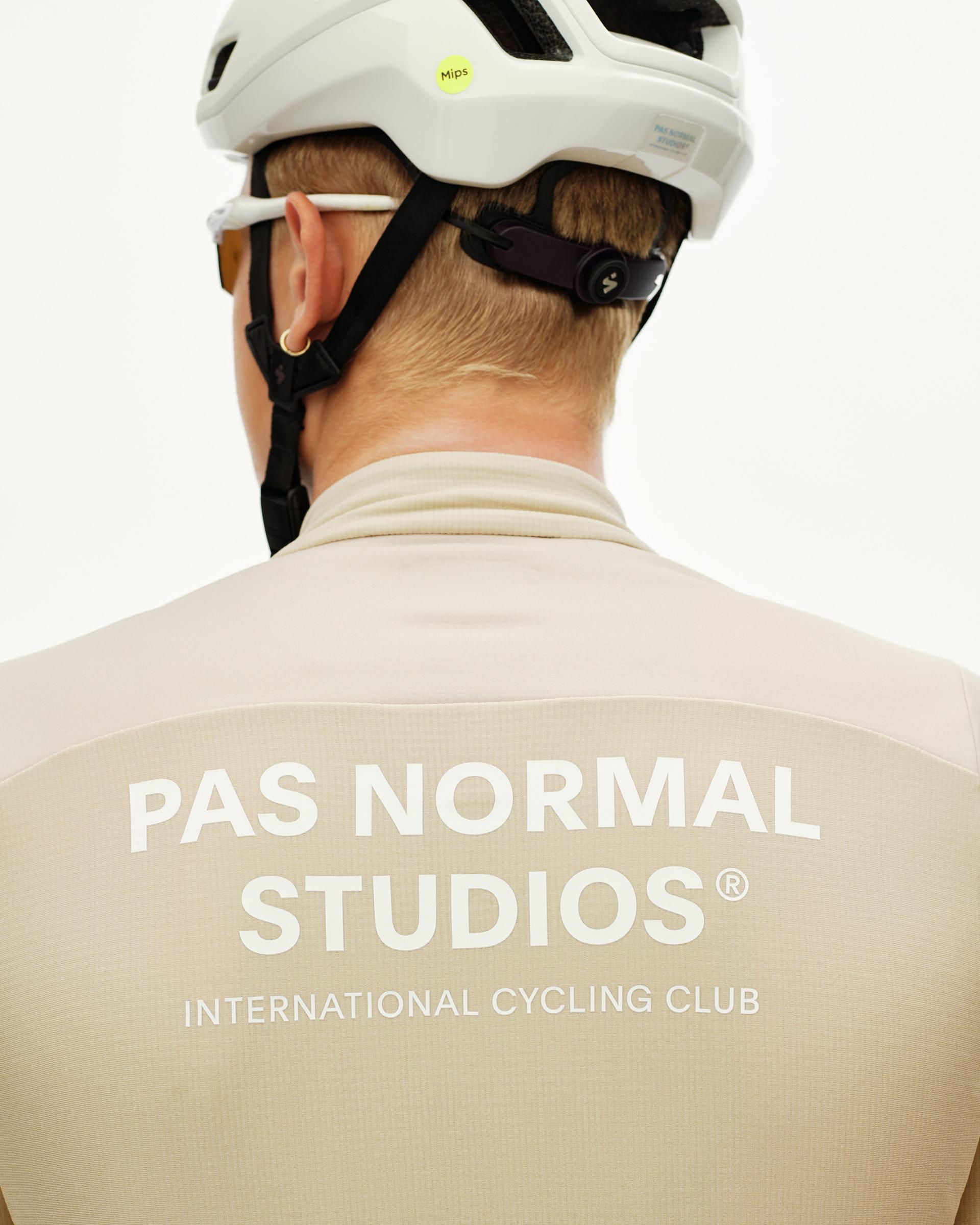 Linen Mechanism Thermal Long Sleeve cycling jersey on model, rear view with large white back print