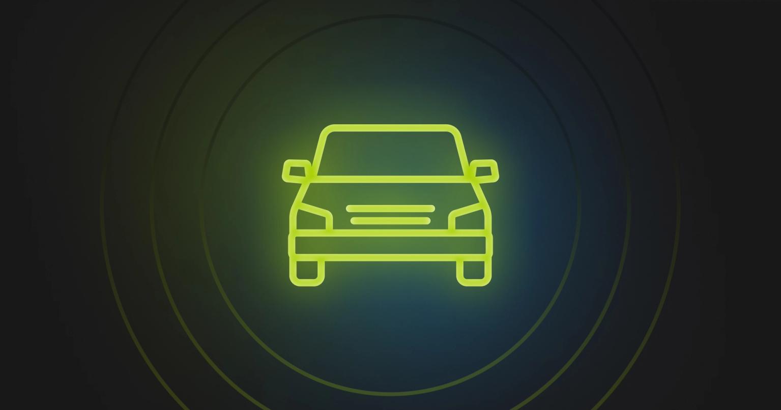 Green icon of an automobile over a dark background