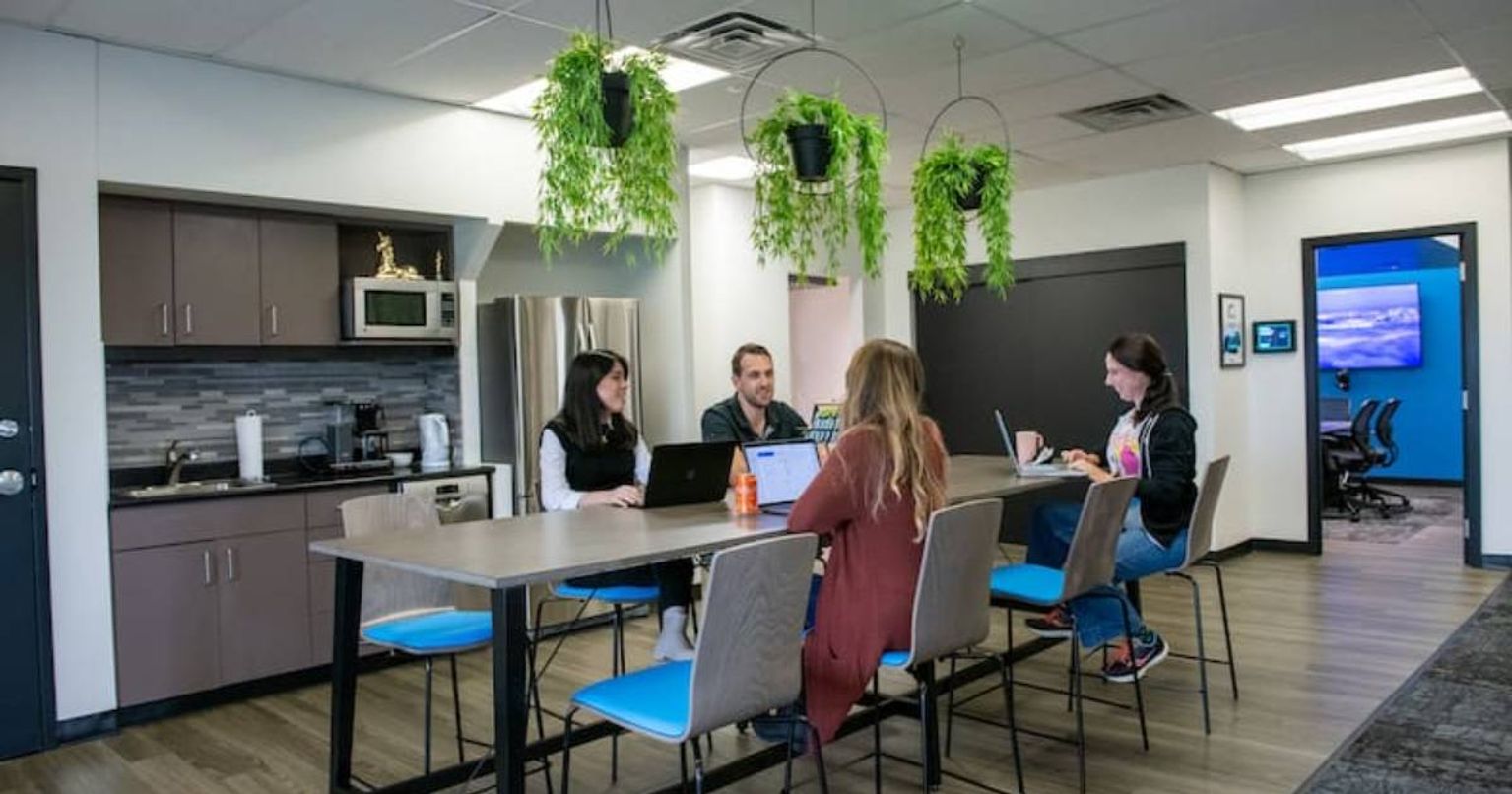 Knak employees sitting in lunch room