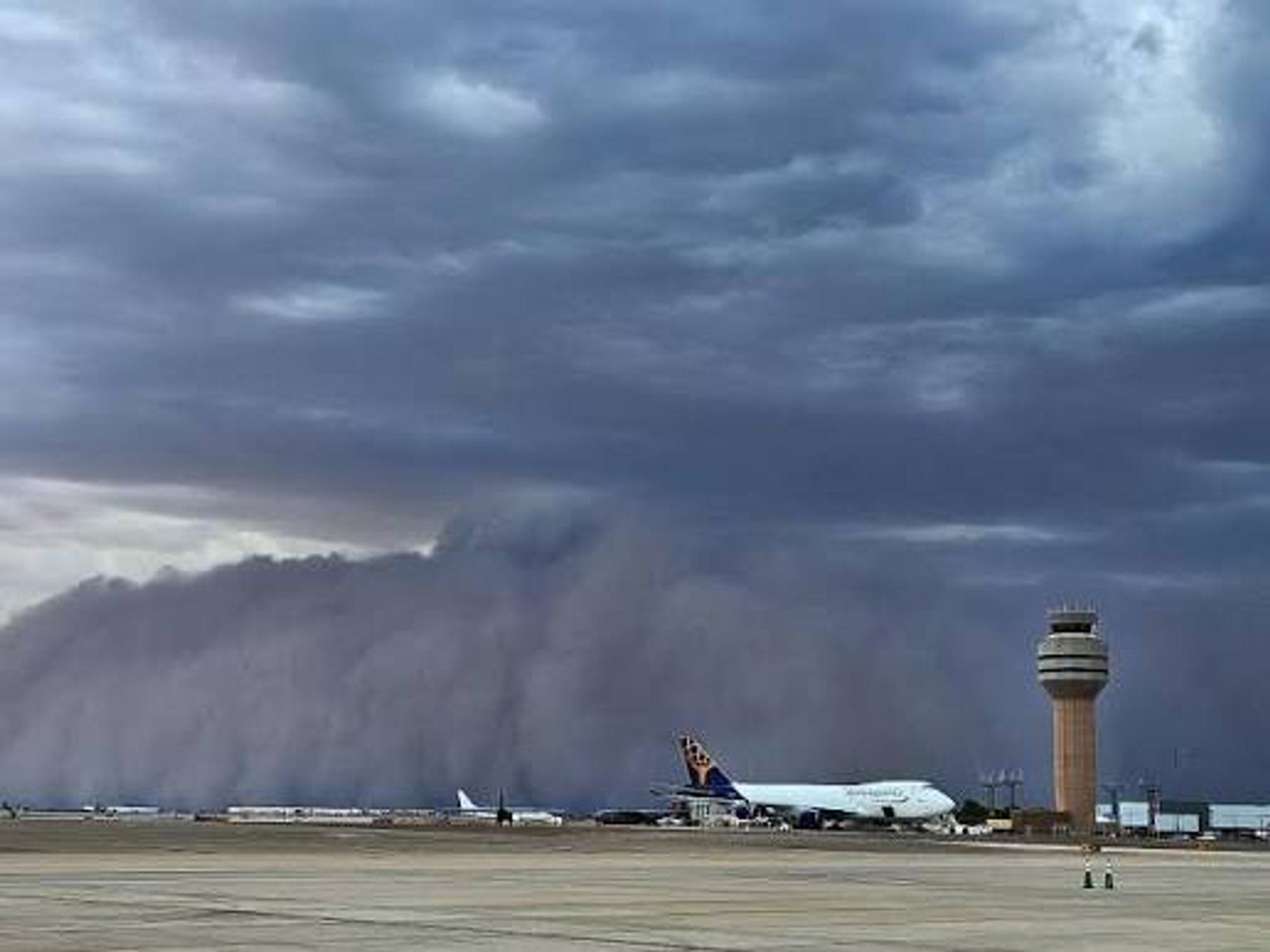 A wall of dust from a haboob rolling across the valley ahead of the microburst that caused the damage