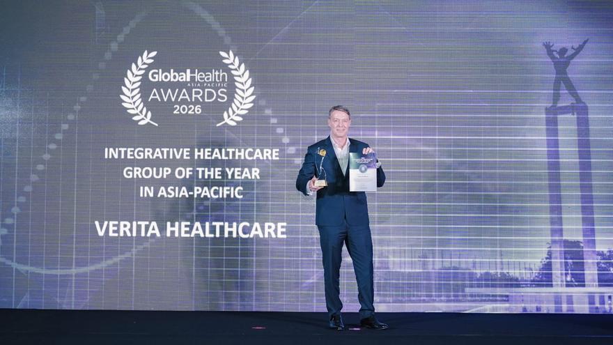Julian Andriesz gets onto the stage to accept the Global Health Awards 2026 as Integrative Healthcare Group of the Year and Health Tech Innovator of the Year in Asia-Pacific.