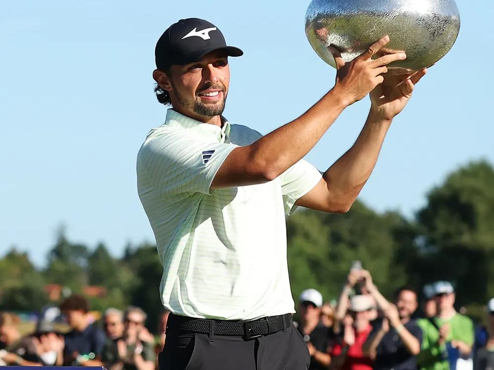Marco Penge holding the trophy