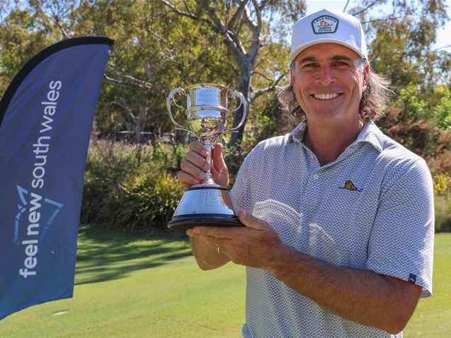Mat Goggin holding the NSW Senior Open Trophy