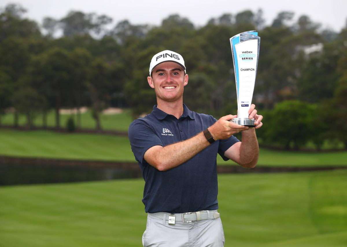 Declan O'Donovan holds the Webex Trophy