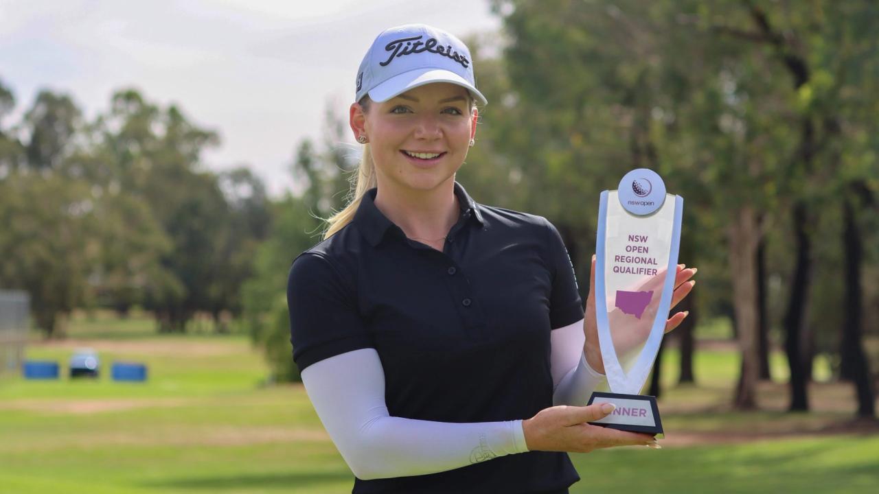 Hannah Reeve holding trophy