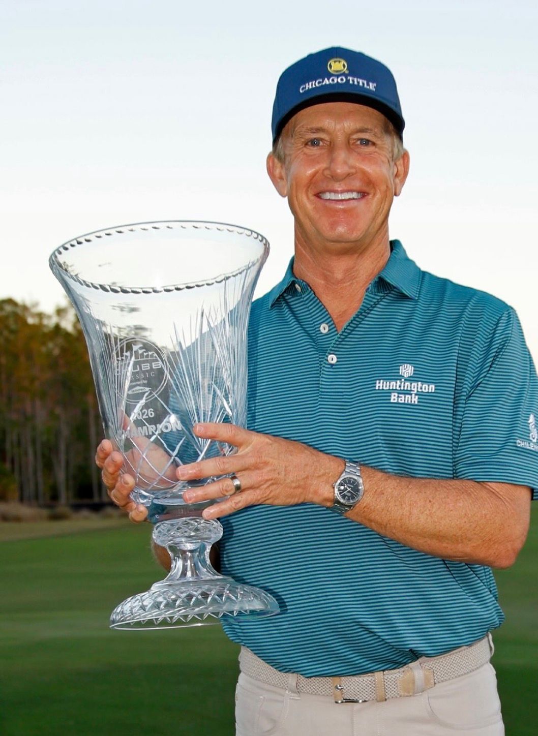 David Toms holds his trophy