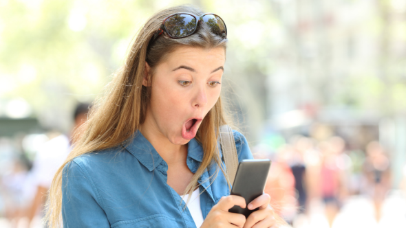 Graduate laughing at the relatable ups and downs of job hunting