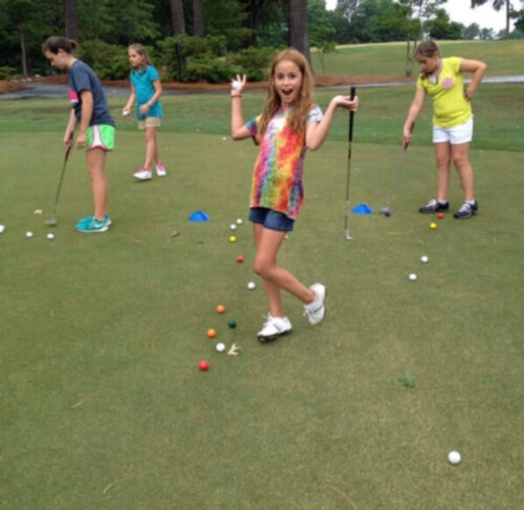 Junior Golfer Practicing Putting