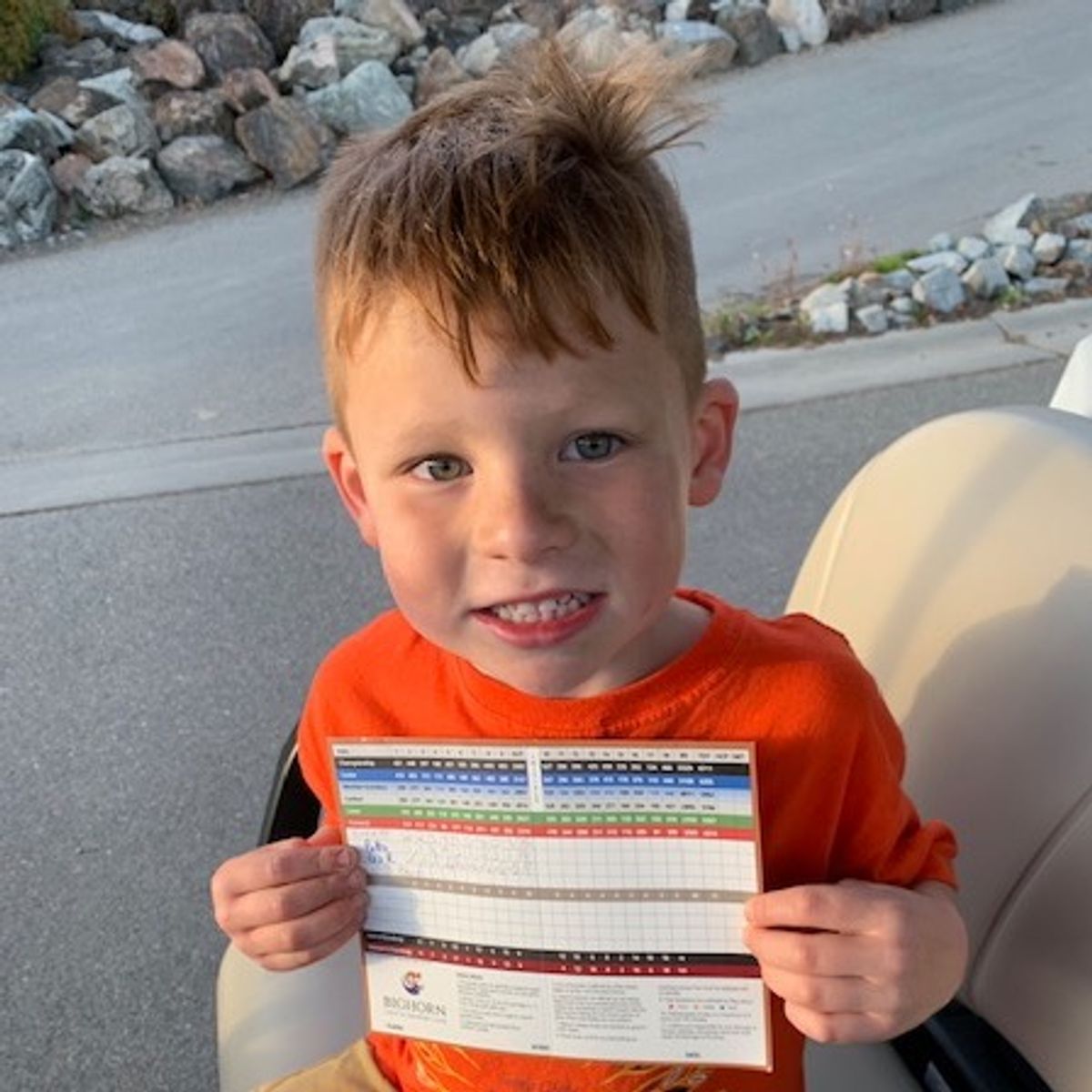 #1inaMillion Golfer Everette Quewezance holding up a scorecard