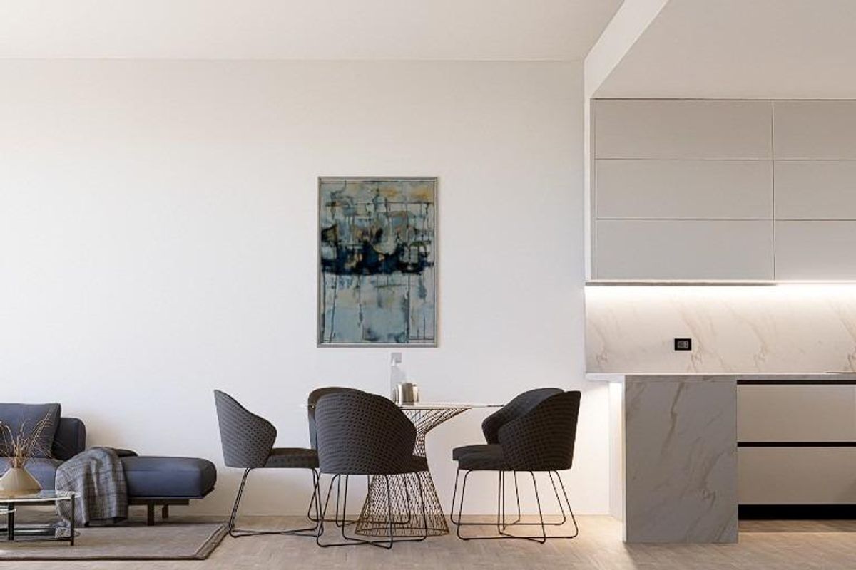 Elegante keuken en eetruimte met slank ontwerp en moderne apparaten in Finestrat bungalow.