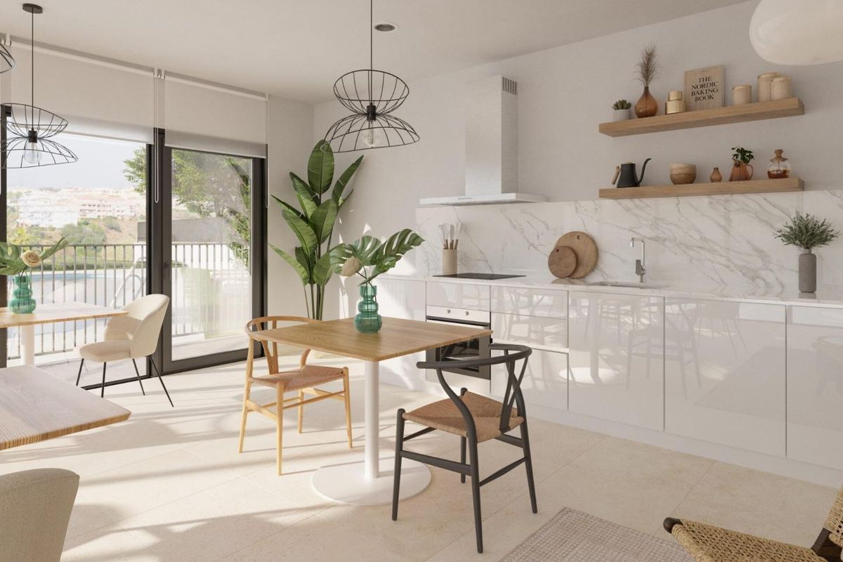 Moderne keuken en eetruimte met stijlvolle inrichting en uitzicht in een appartement met 2 slaapkamers in Mijas.