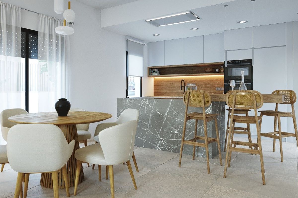 Eigentijdse keuken en eetruimte in een villa, gemaakt van moderne materialen en ontwerp.