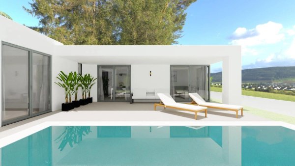 Modern villa exterior with pool and sun loungers in Monforte del Cid, Costa Blanca South, Spain.