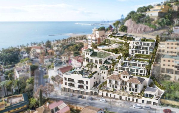 Luchtfoto van een modern appartementencomplex in Málaga, vlakbij de kust, met een mix van traditionele en hedendaagse stijlen.