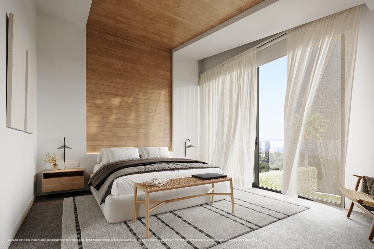 Moderne slaapkamer in een villa in Mijas, met stijlvolle meubels en panoramisch uitzicht.