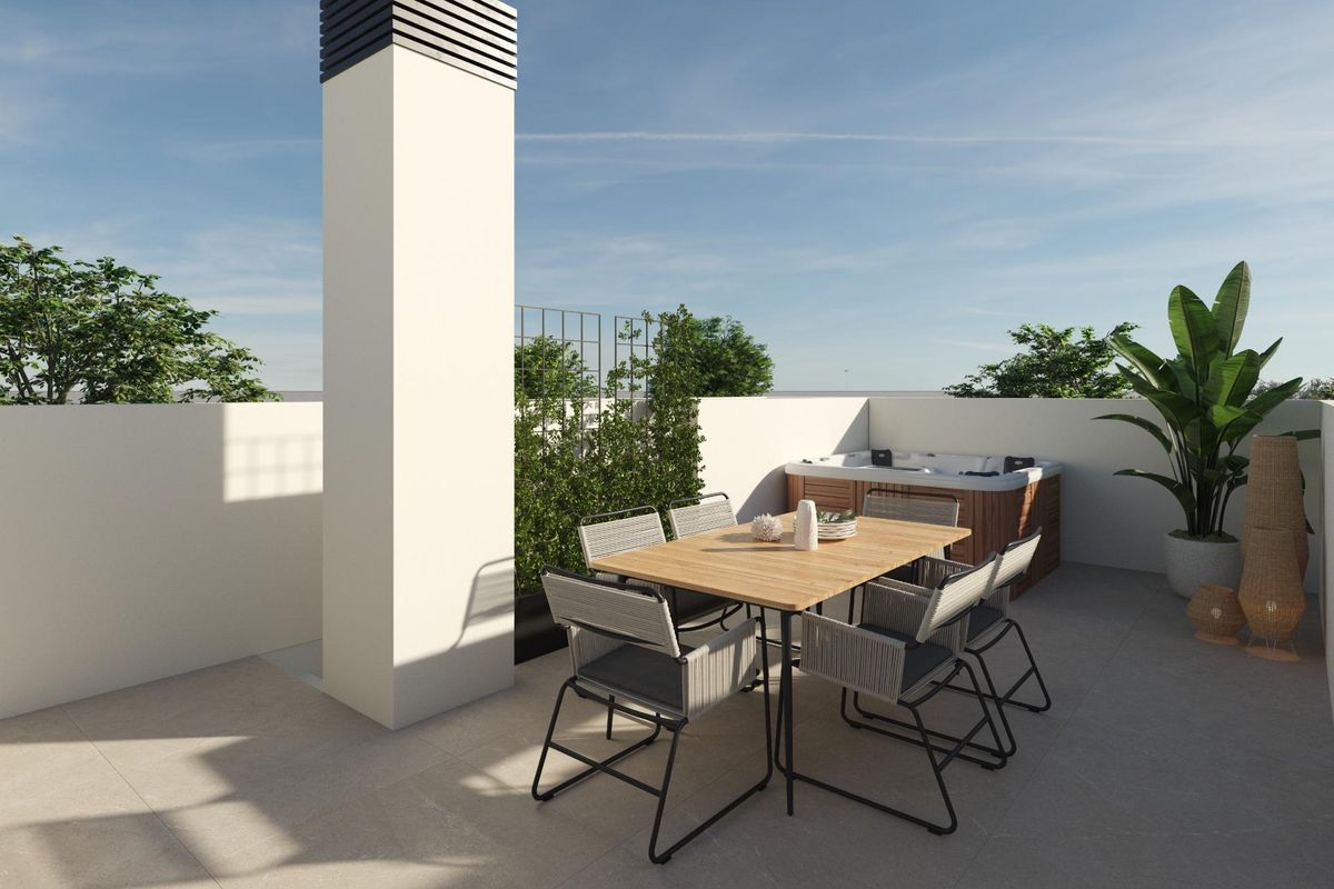 Stylish rooftop terrace of a 3-bed townhouse in Dolores, Spain, featuring a dining table, chairs, and a relaxing hot tub.