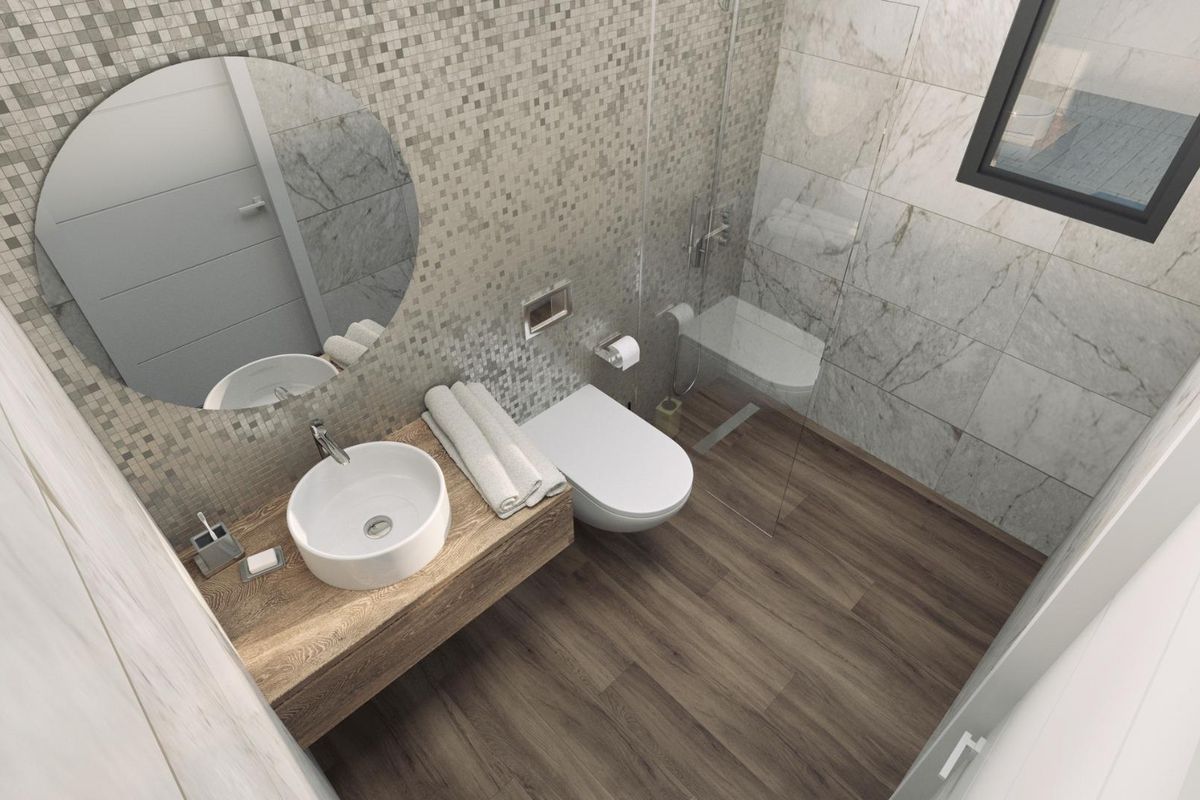 Stijlvolle en functionele badkamer in een villa in Costa Blanca, benadrukt door natuurlijke texturen.