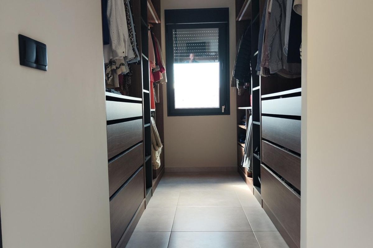 Walk-in closet organized with shelves, located in a 3-bed villa in Pinoso, Costa Blanca South, Spain.