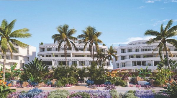 Buitenzicht op een modern appartementengebouw met 2 slaapkamers, omgeven door weelderige tuinen in Mijas, Costa del Sol.