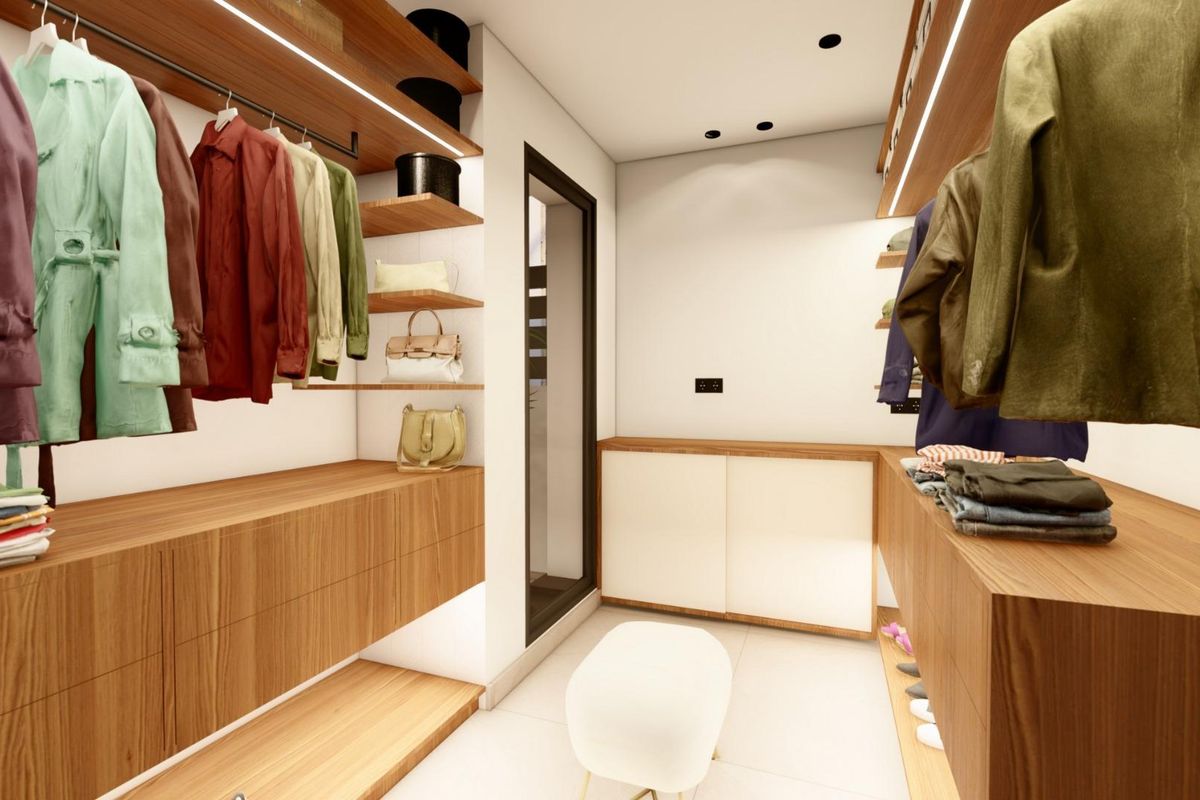 Een andere hoek van de stijlvolle inloopkast met georganiseerde kledingopslag in de villa in Benijofar.