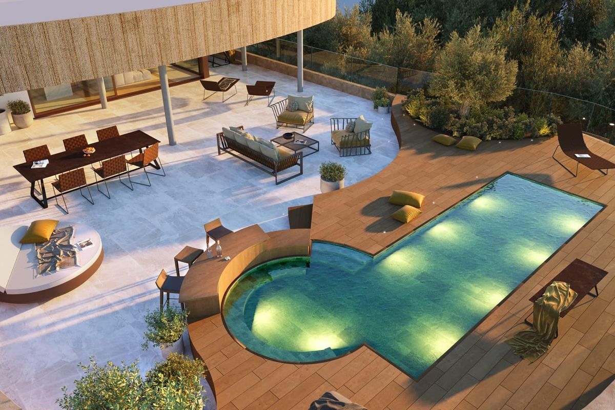 Luchtbeeld van het zwembadgebied van de penthouse omringd door weelderig groen en lounges in Fuengirola.