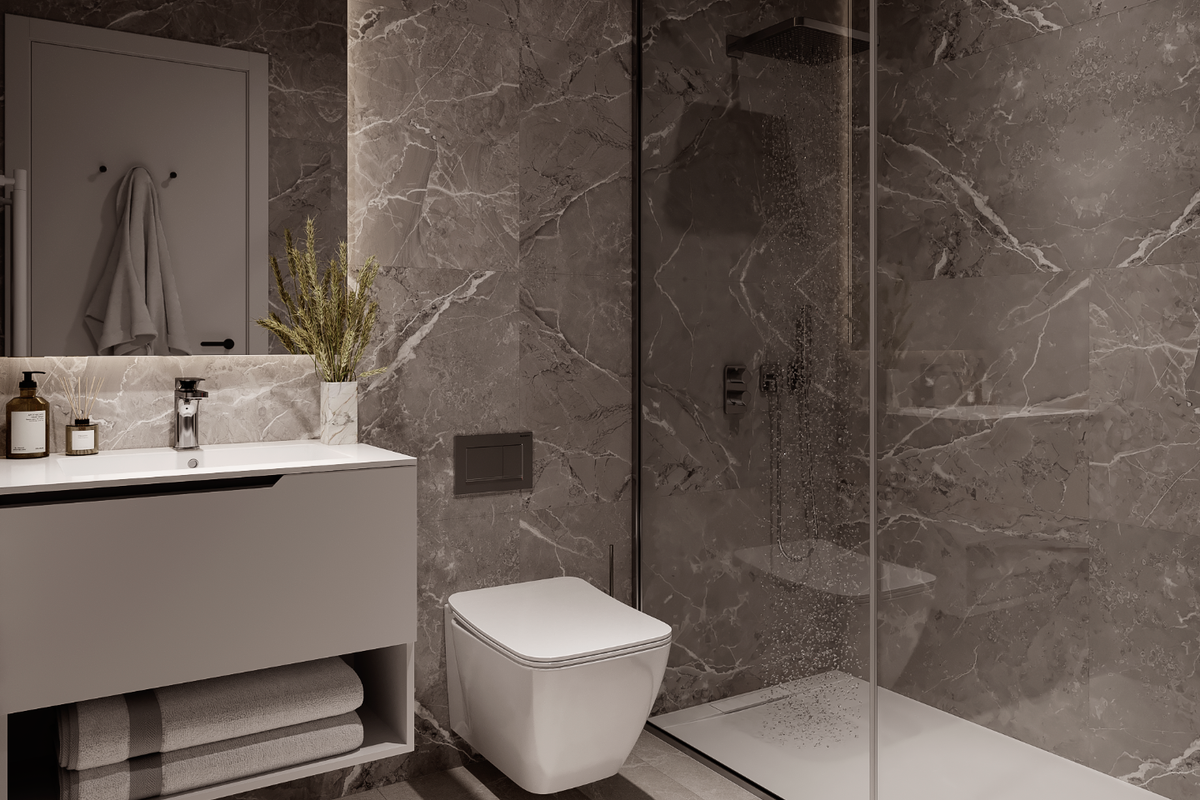 Strak badkamer met elegante marmeren details en een glazen douche in een penthouse in Calpe.
