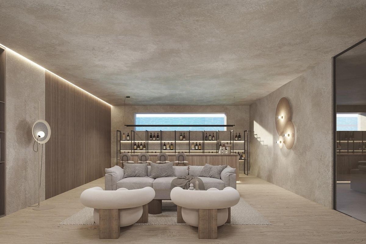 Stijlvolle woonkamer met een bar en natuurlijke decoratie, perfect voor entertainment in de villa.