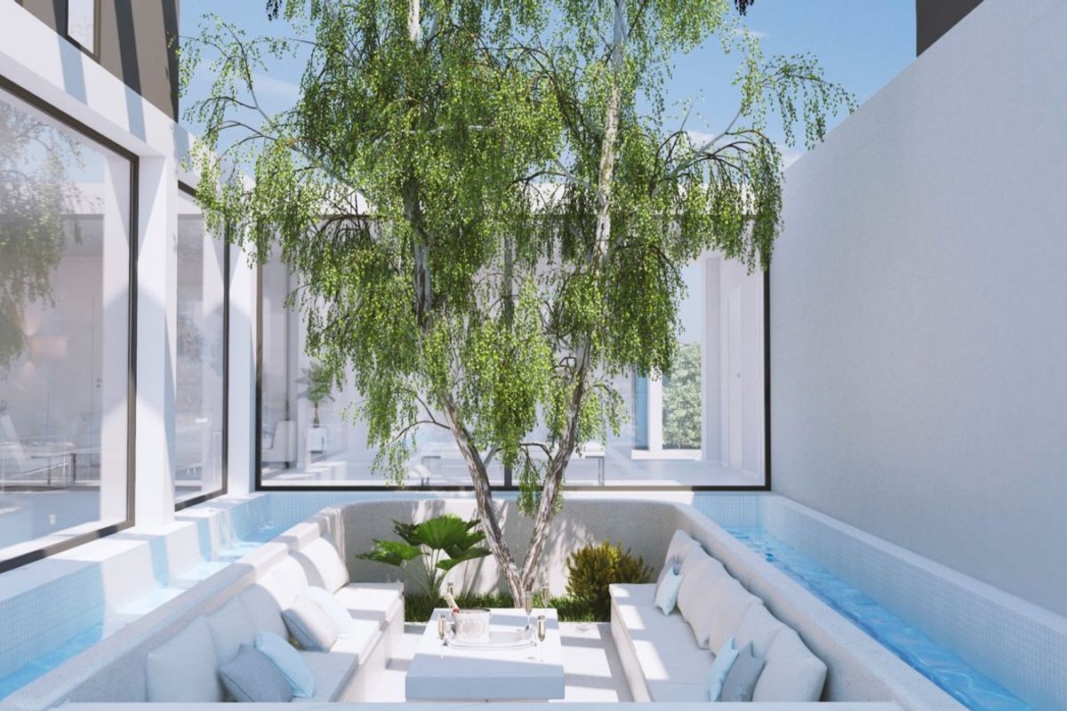 Relaxing outdoor seating area surrounded by water features, perfect for leisure in Baños y Mendigo villa.