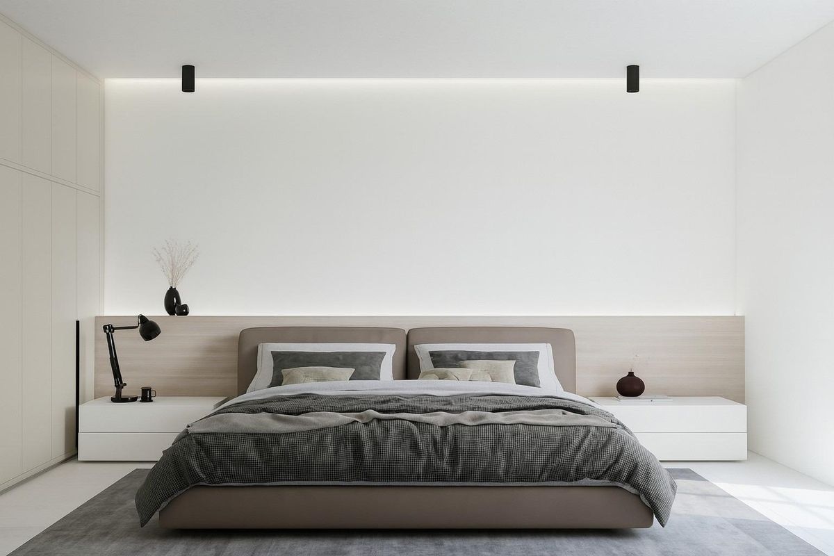 Moderne slaapkamer in appartementen in Estepona met een groot bed en minimalistische inrichting.