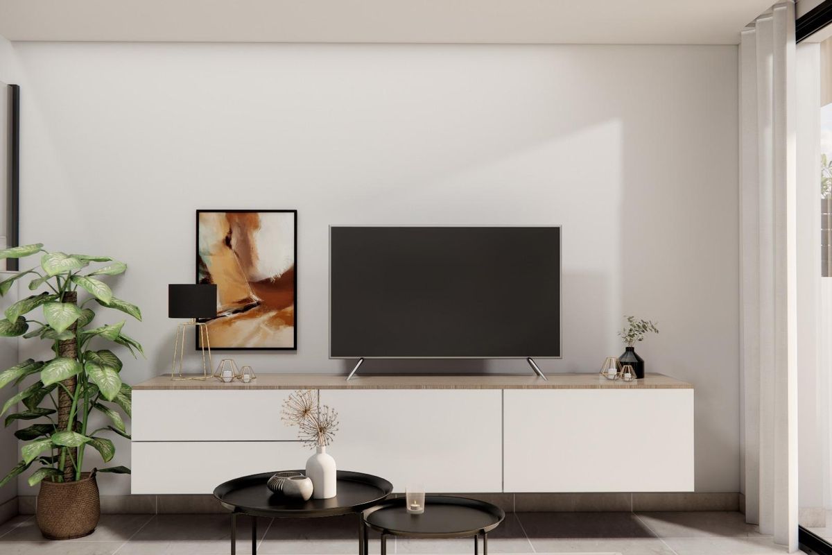 Moderne entertainmentruimte in de townhouse, met een tv en stijlvolle decoratie in Rojales.