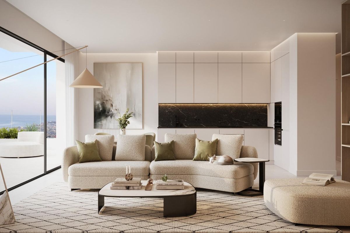 Moderne woonkamer met ruime bank en kitchenette, met uitzicht op zee vanuit het penthouse in Mijas.
