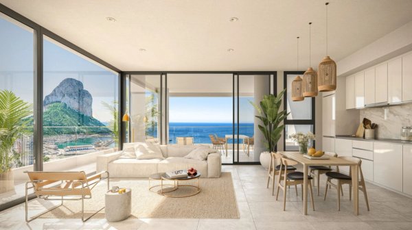 Moderne woonkamer van een 3-slaapkamer penthouse in Calpe, met grote ramen en prachtig zeezicht.