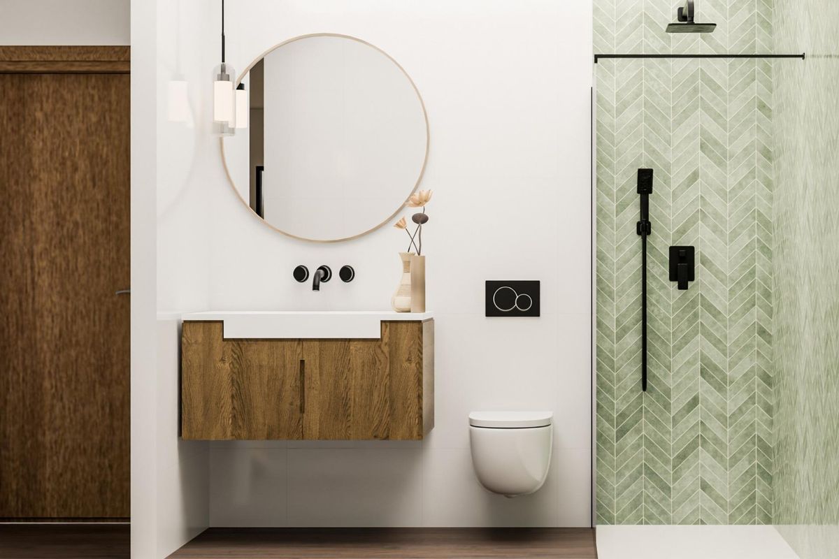 Modern bathroom with a unique green tiled wall and elegant fixtures, part of a 3-bedroom villa in Pinoso, Costa Blanca.