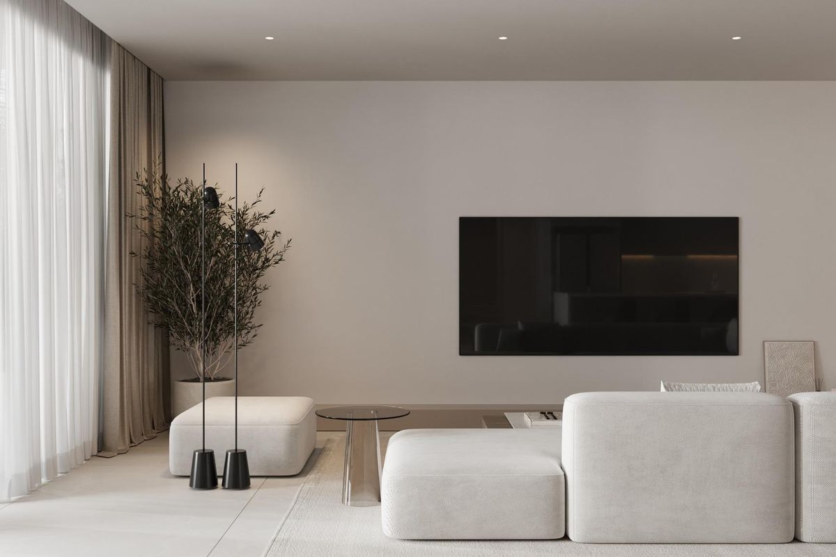 Stijlvol ingerichte woonkamer in de penthouse in Estepona, met modern decor en natuurlijk licht.