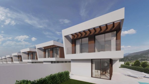 Rij moderne villa's met 3 slaapkamers in Finestrat, costa blanca noord, met een strak, minimalistisch exterieurontwerp en uitzicht op de bergen.
