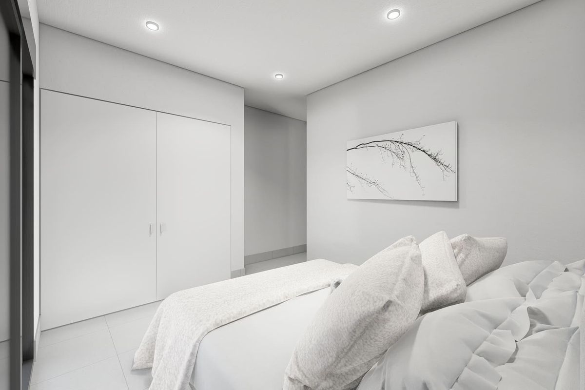 Heldere en minimalistische inrichting in een derde slaapkamer van een 3-slaapkamer townhouse in Torre Pacheco, Costa Calida.