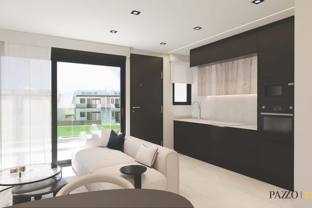 Lichtgevulde woonkamer met moderne keuken in een bungalow, gelegen in Pilar de La Horadada, Costa Blanca.