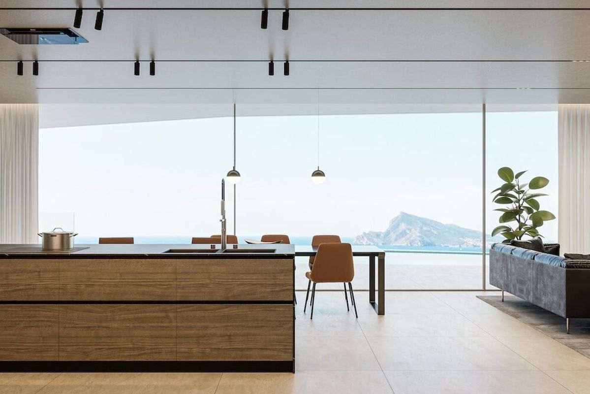 Strakke keuken en eetkamer met uitzicht op zee in een moderne villa in Altea, Costa Blanca.
