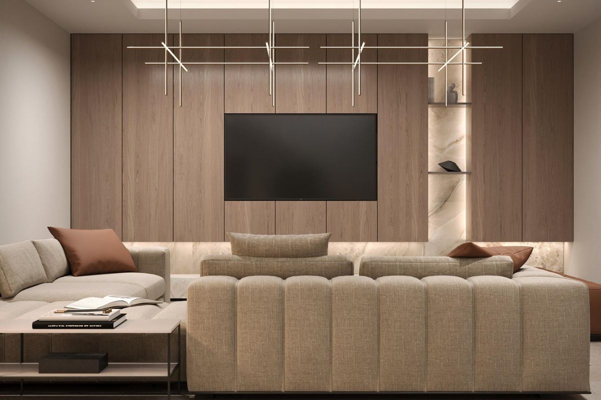 Ruime woonkamer met moderne decoratie en een tv-muur in een villa in Mijas.