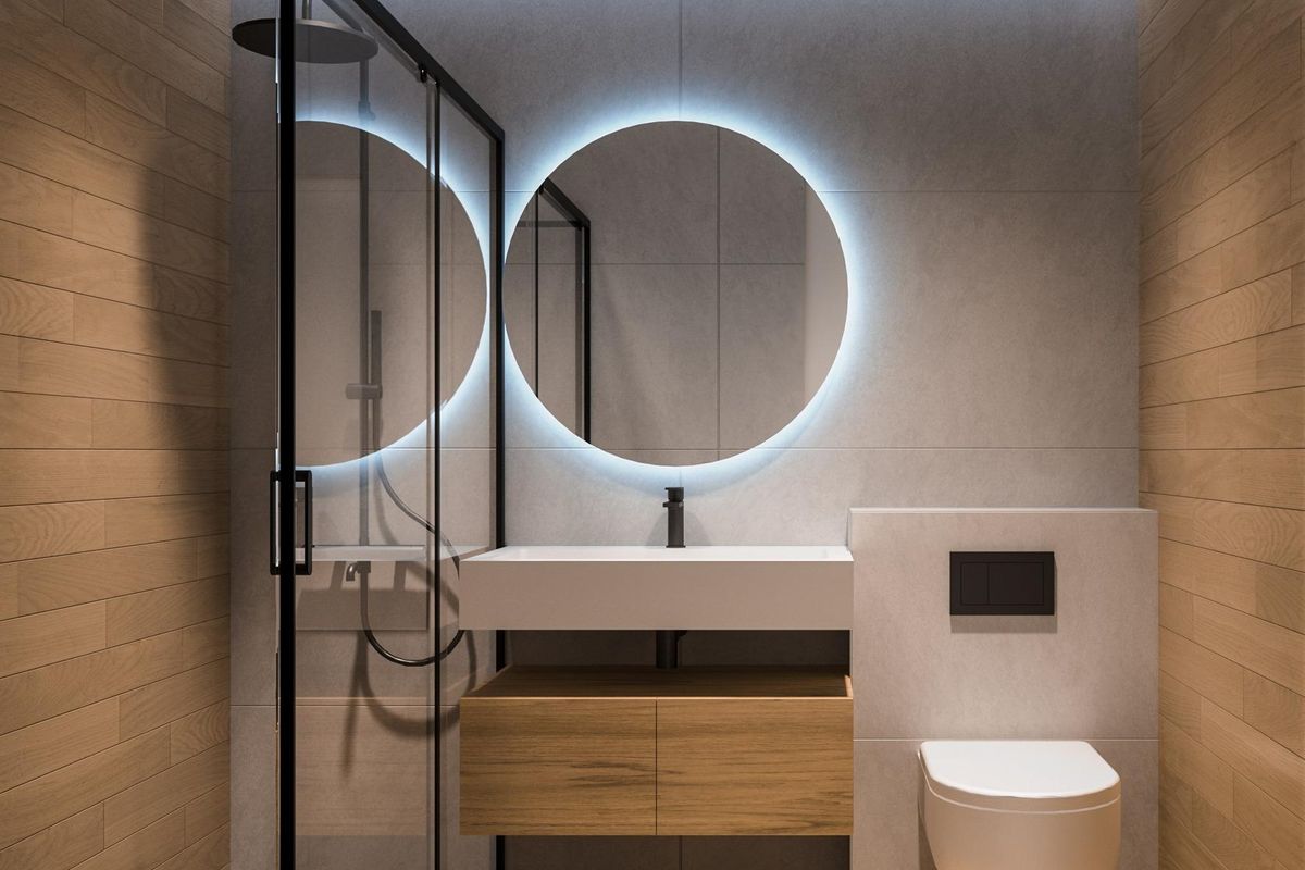 Moderne badkamer met elegante armaturen en zachte verlichting in een appartement in Torrevieja, wat een ontspannende sfeer creëert.