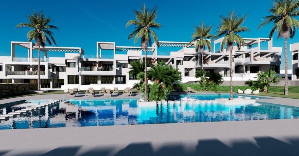 Stylish bungalow complex with palm trees and a pool in Finestrat, Costa Blanca North, Spain.