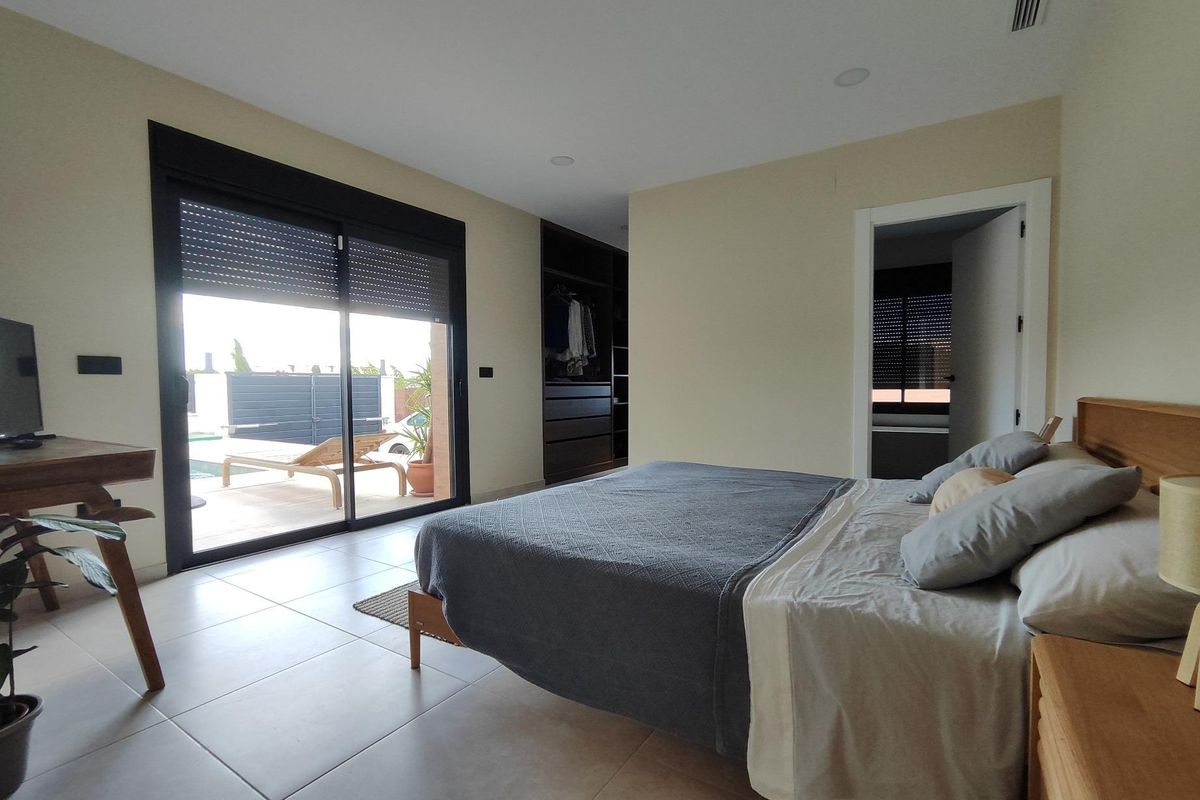 Spacious bedroom with patio access in a contemporary villa located in Pinoso, Costa Blanca South, Spain.