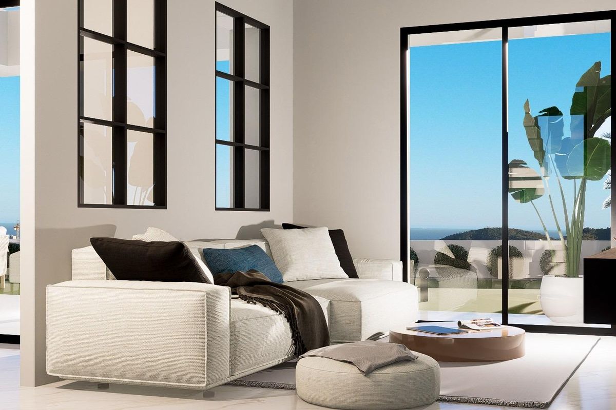 Gezellige zithoek in een 3-slaapkamer villa in Finestrat, ontworpen voor ontspanning met uitzicht op de tuin.