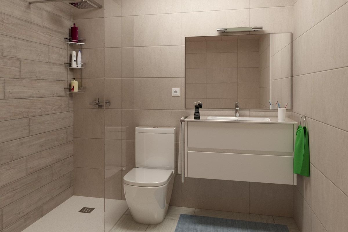 Stijlvolle badkamer met een douche, moderne armaturen en een stijlvolle tegelontwerp.