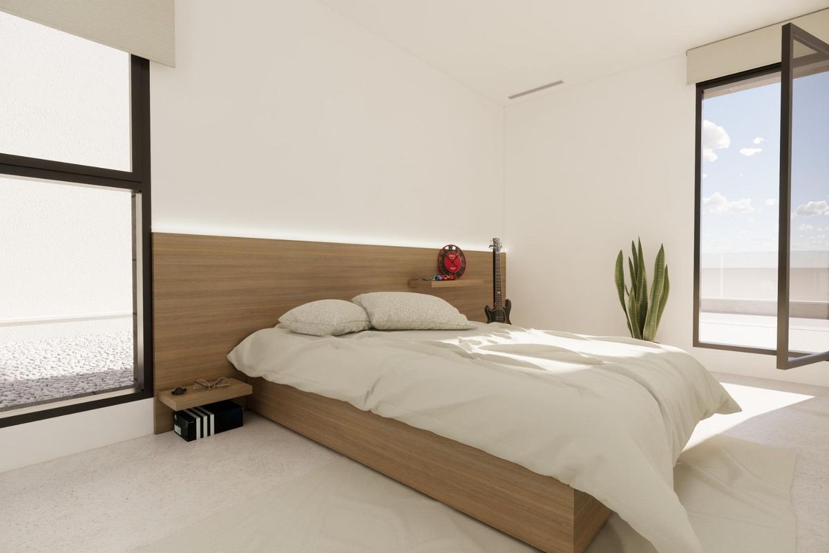 Heldere slaapkamer met minimalistische decoratie en toegang tot een terras, onderdeel van een 3-slaapkamer huis in Dolores, Costa Blanca Zuid.