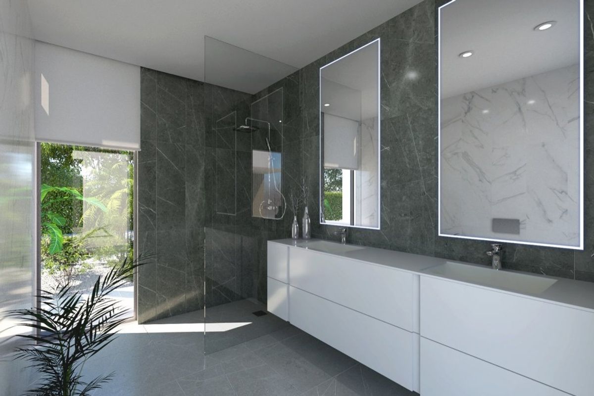 Elegant bathroom in Baños y Mendigo villa, showcasing modern fixtures and natural lighting.