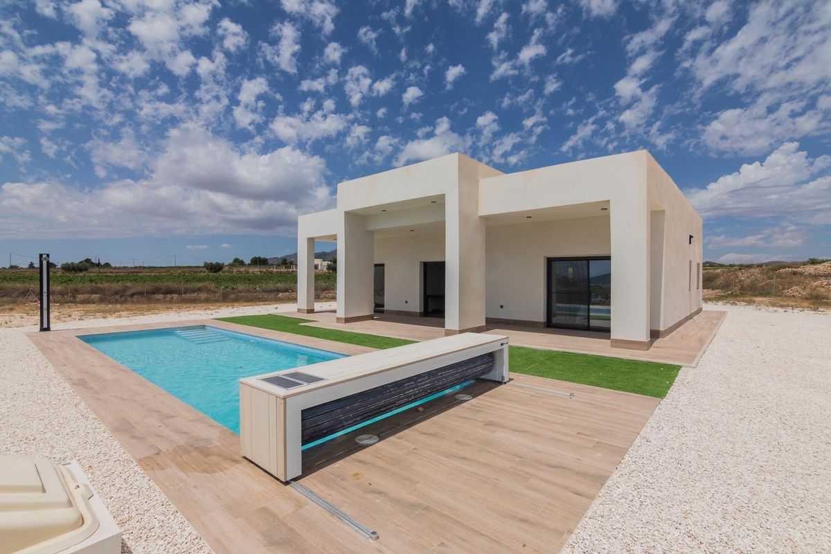 Pool area of the contemporary villa in Pinoso, Costa Blanca South, emphasizing relaxation and luxury.